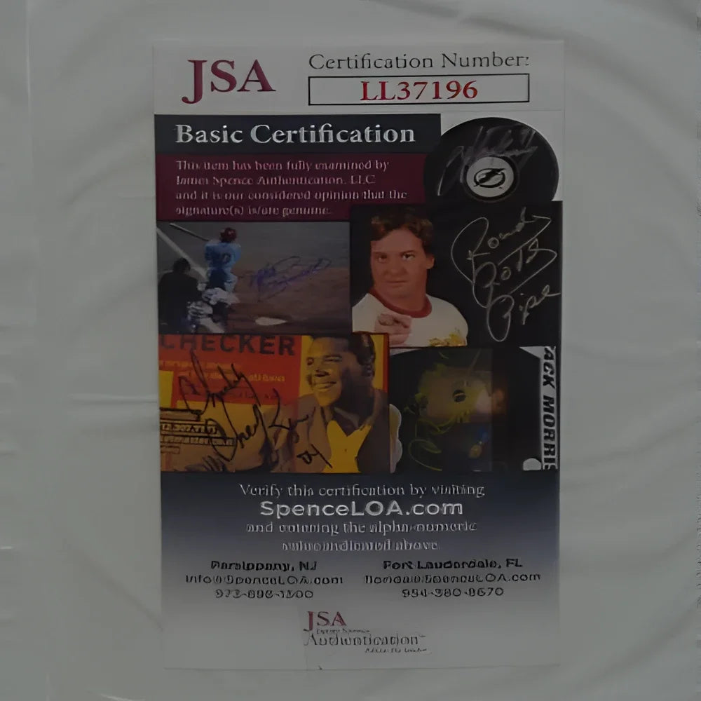 This is a jsa basic certification card for an autographed hockey trading card featuring the signature of rockie johnson, with his name and ’rocky’ printed in black ink on the right side.