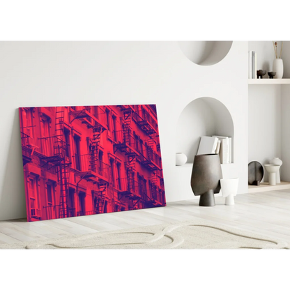 Vibrant red purple cityscape glass wall art print with fire escapes