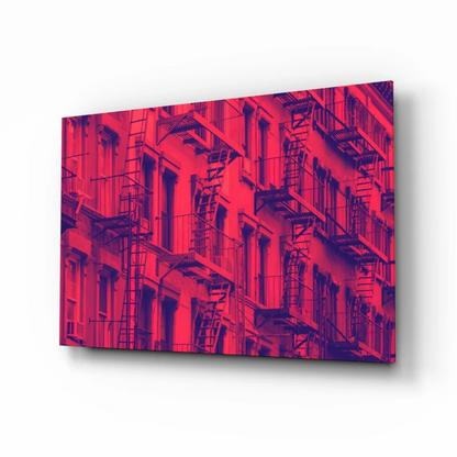 Vibrant red purple abstract cityscape glass wall art with fire escapes