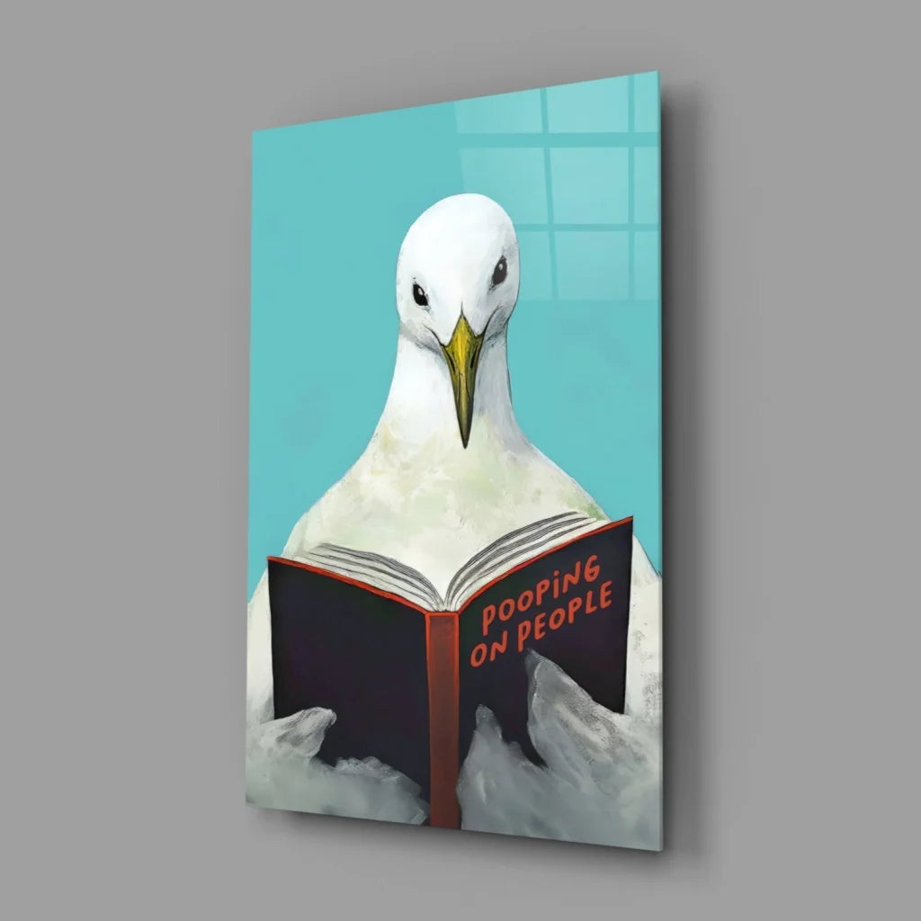 Funny white seagull with yellow beak reading Pooping on People book on glass wall art canvas print
