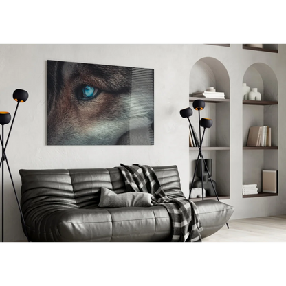 Piercing blue wolf eye canvas wall art print on black sofa