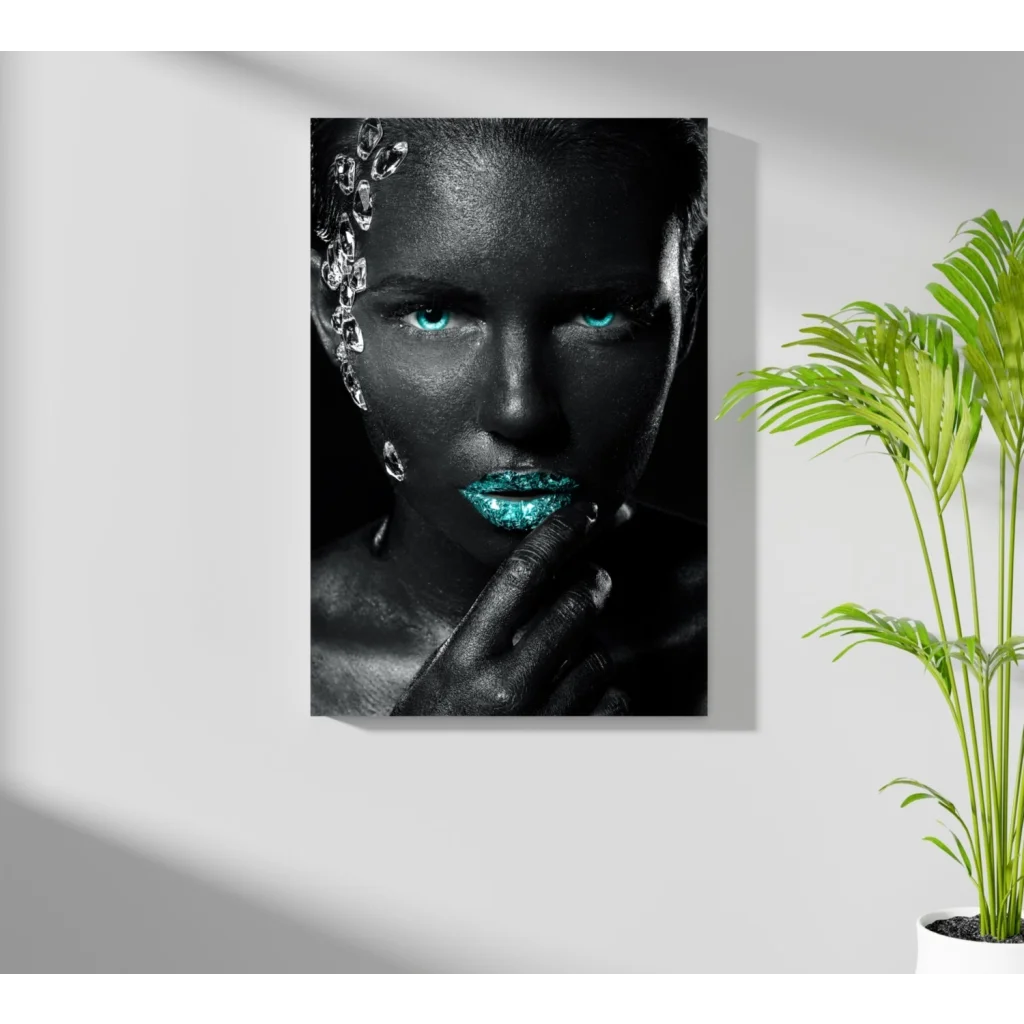 Striking black-and-white insigne aluminum print of woman with glowing turquoise eyes and crystal adornments