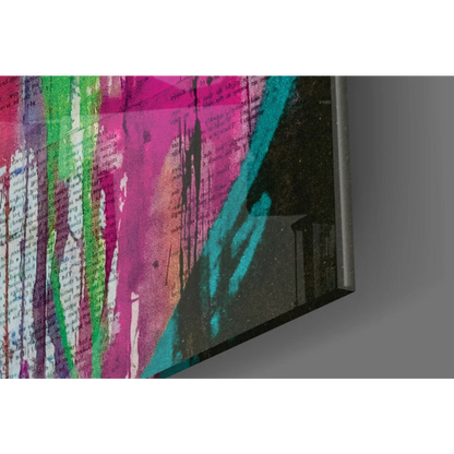 Vibrant glass wall art with bold pink, green, teal splashes over textured text