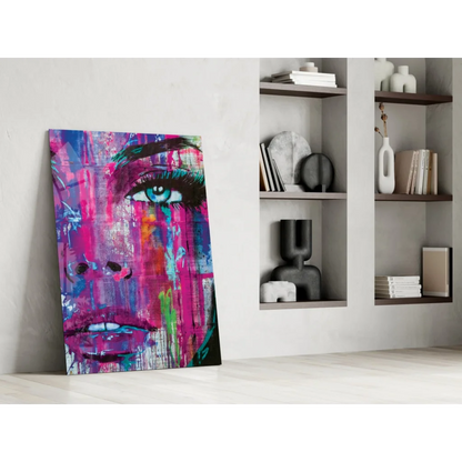 Vibrant abstract portrait glass wall art in bold pink, purple, blue hues with turquoise eye
