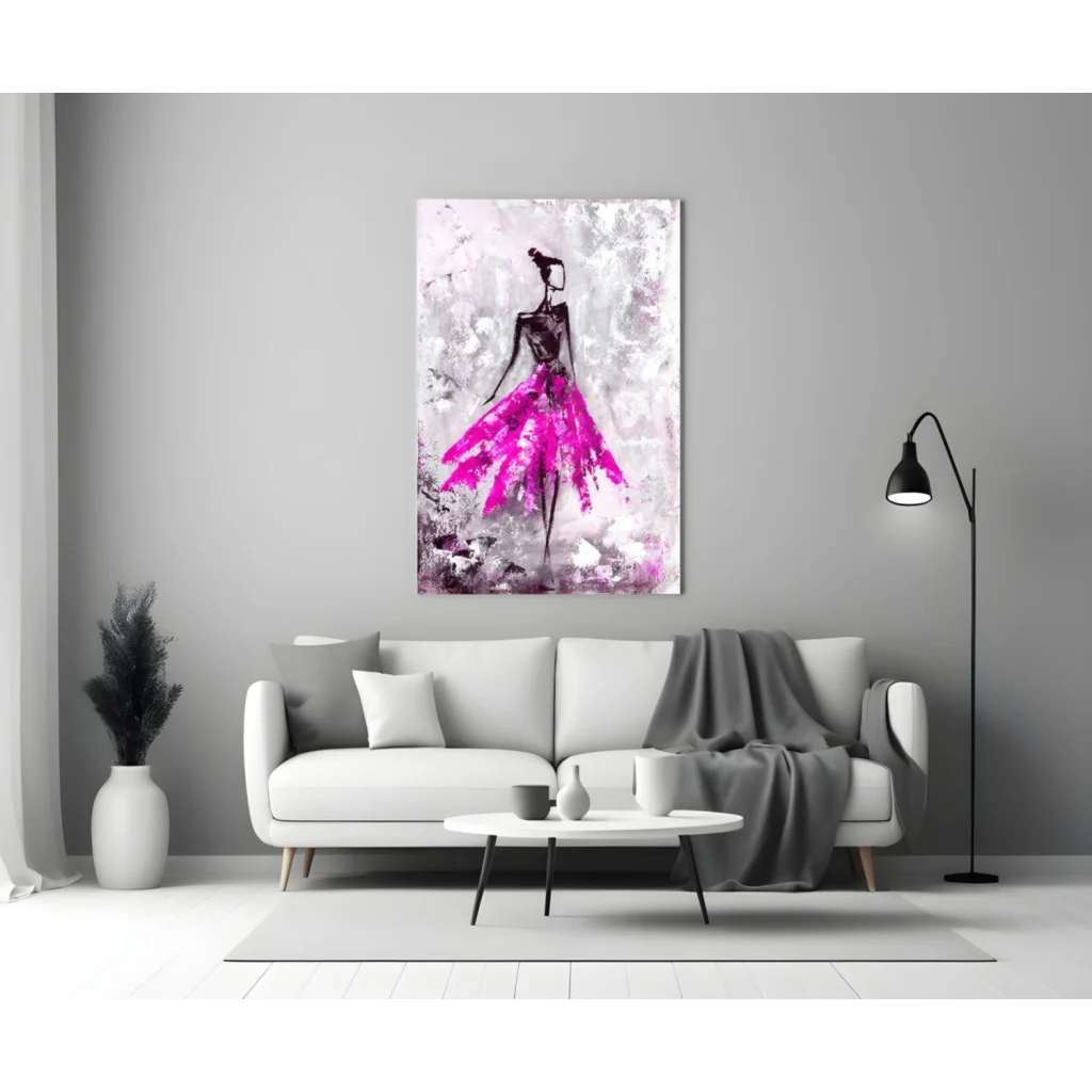 Vibrant pink glass wall art of ballerina in motion above white sofa