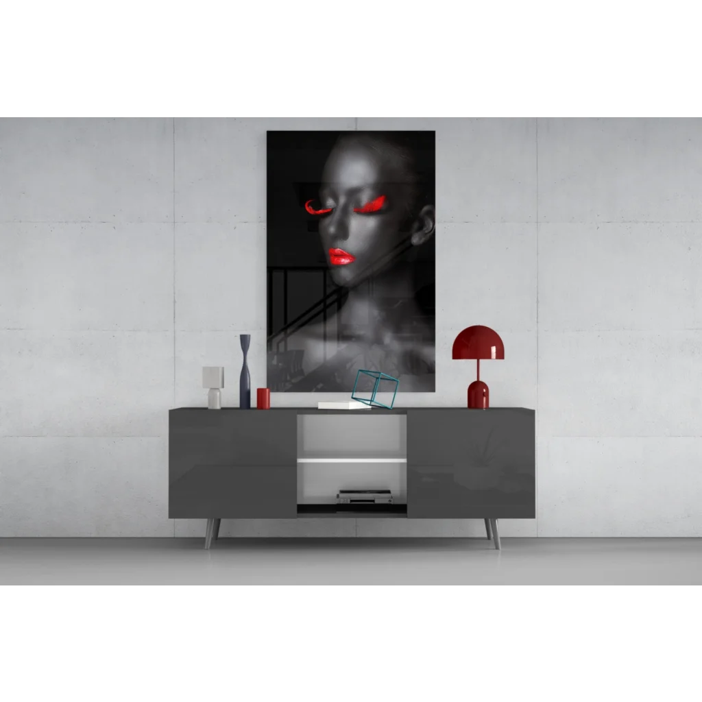 Striking black-and-white glass wall art portrait of woman with glowing red eyes and lips