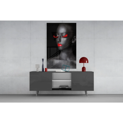 Striking black-and-white glass wall art portrait of woman with glowing red eyes and lips
