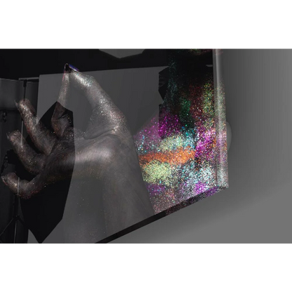 Glittery silver hand holds shimmering iridescent rainbow glass wall art