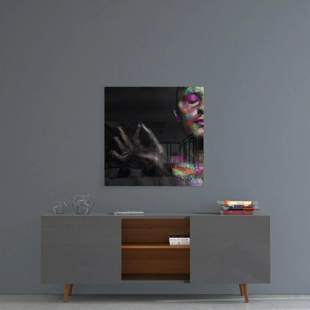 Vibrant abstract face on shimmering rainbow glass wall art with glittery makeup