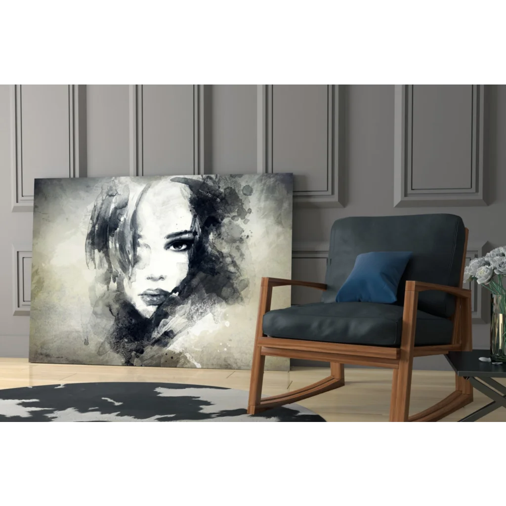 Black and white abstract watercolor portrait of expressive eyes on gray wall