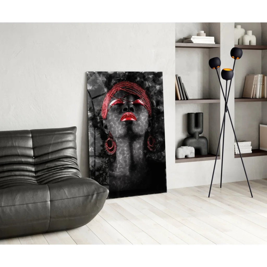 Striking black-and-red canvas wall art of woman with bold red lips and beaded headwrap in modern living room