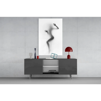 Abstract black-and-white silhouette of figure against glass, glass wall art canvas print