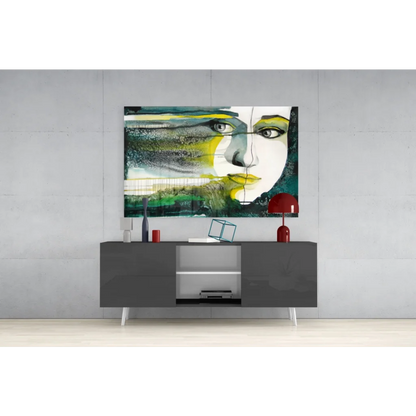 Bold abstract face glass wall art with vibrant yellow and teal tones