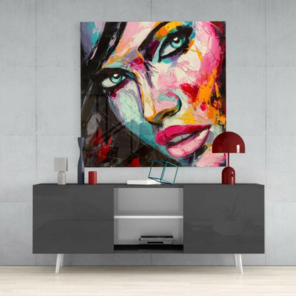 Vibrant glass wall art with pink teal brushstrokes bold green eyes