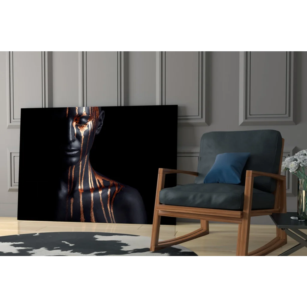 Black canvas wall art of woman with golden metallic streaks on face and neck