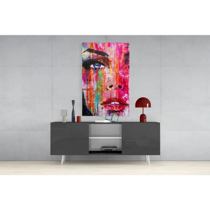 Vibrant abstract portrait glass wall art in pink, orange, blue hues