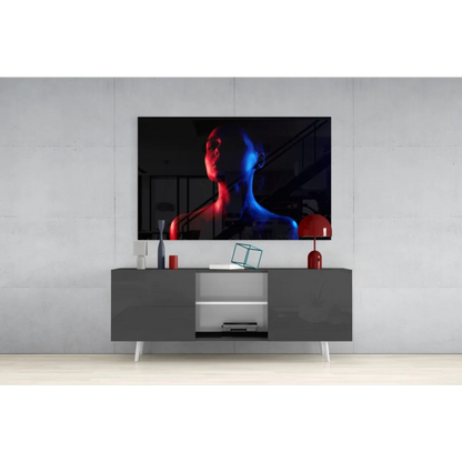 Sleek black TV displaying Neon Silhouette glass wall art in electric red and blue