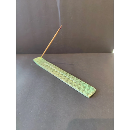 Light green wood printed incense burner with geometric pattern and burning stick
