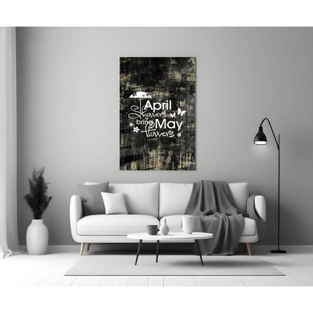 Black and white wall art canvas print with April showers bring May flowers quote and butterflies above sofa
