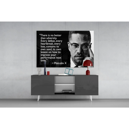 Malcolm X black-and-white portrait wall art canvas with quote on gray table