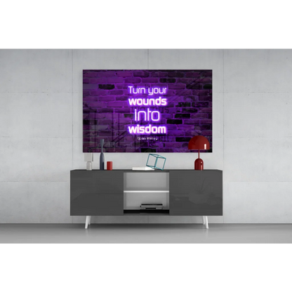 Purple neon glass wall art: Turn your wounds into wisdom on brick wall