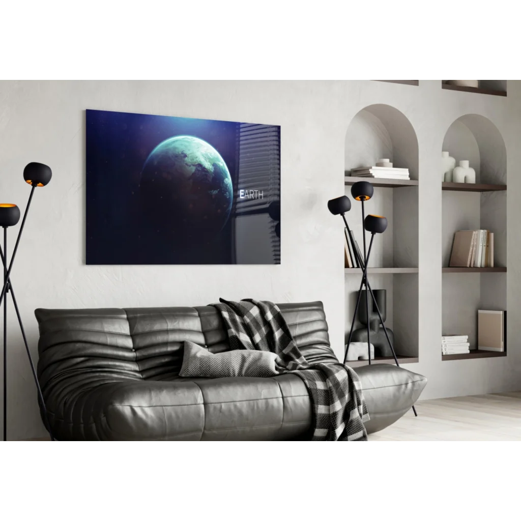 Black leather sofa with quilted texture and gray throw on Earth Canvas glass wall art