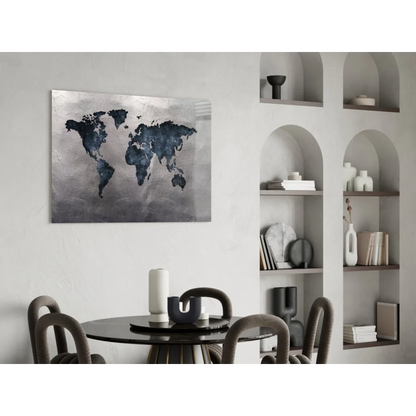 Distressed world map glass wall art canvas with blue continents on silver-gray background