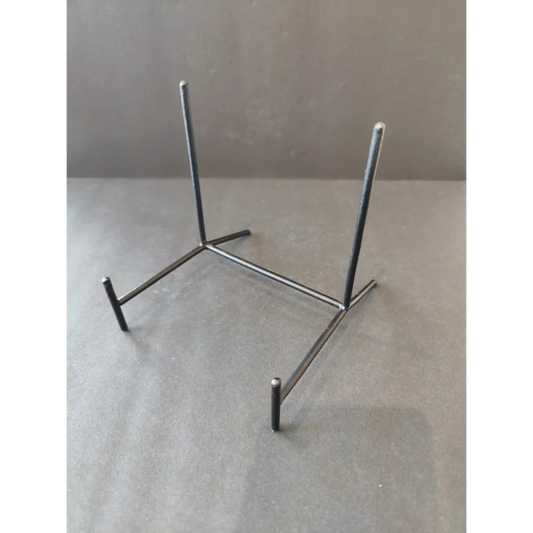 Wrought iron black display stand with four sturdy legs