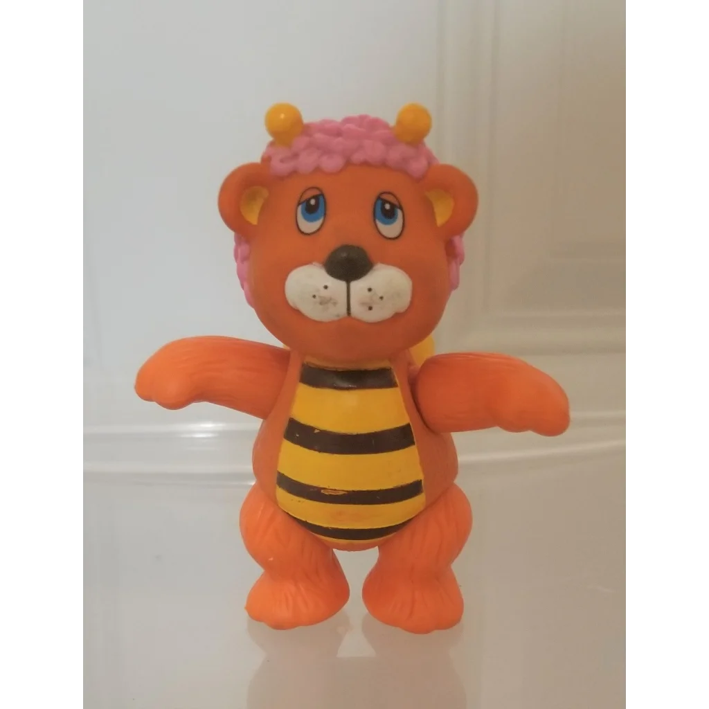 Vintage 1985 Wuzzles Bumblelion PVC figure toy with orange lion body, bee stripes, yellow horns