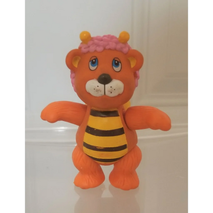 Vintage 1985 Wuzzles Bumblelion PVC figure toy with orange lion body, bee stripes, yellow horns