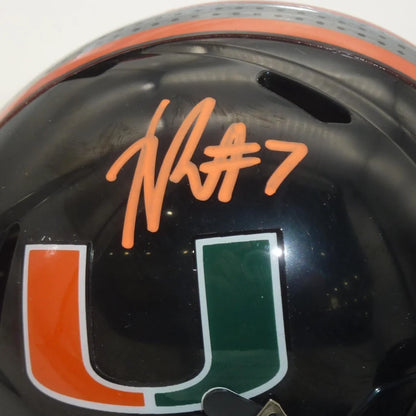 Xavier Restrepo signed Miami Hurricanes mini helmet in black with orange green accents
