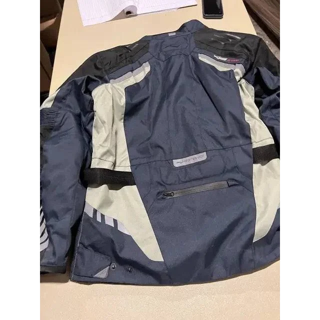 Dark blue and grey XPRO Ski Jacket with heavy lining, reflective accents, and zip pocket