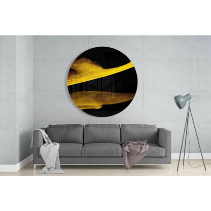 Stunning gold streak tempered glass art on black, above gray sofa