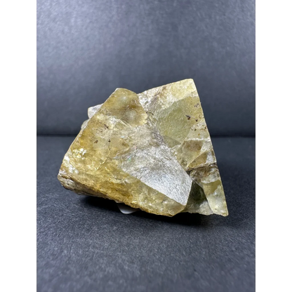 Yellow cubic fluorite cluster with translucent yellow-green crystal and metallic sheen