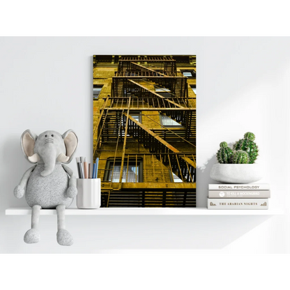 Golden-brown fire escape on brick wall, yellow staircase canvas print