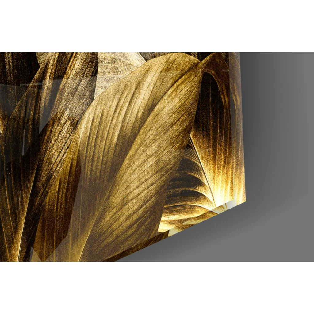 Golden leaf glass wall art with glossy metallic finish