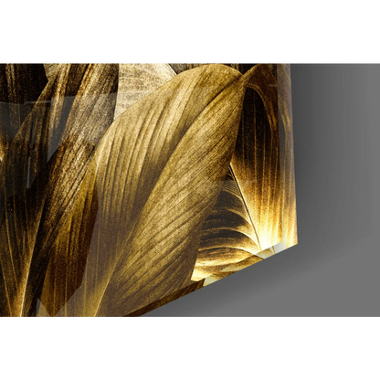 Golden leaf glass wall art with glossy metallic finish