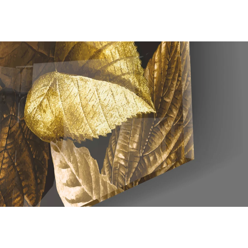Golden leaf textured metallic panel in glass wall art on dark background