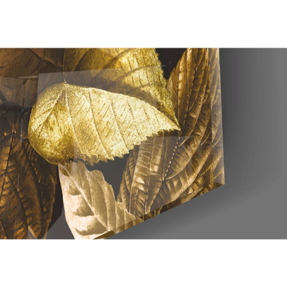 Golden leaf textured metallic panel in glass wall art on dark background