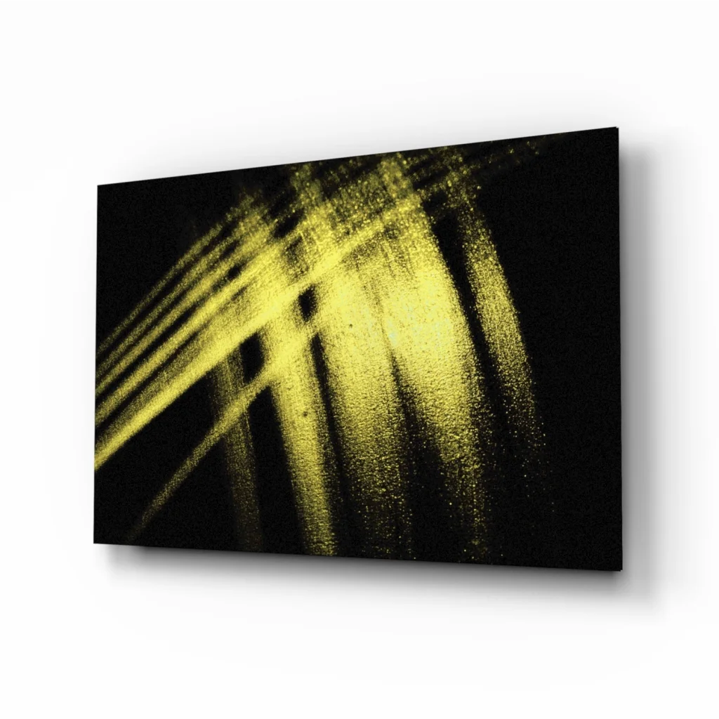 Bold yellow brushstroke glass wall art on black canvas with abstract light streaks
