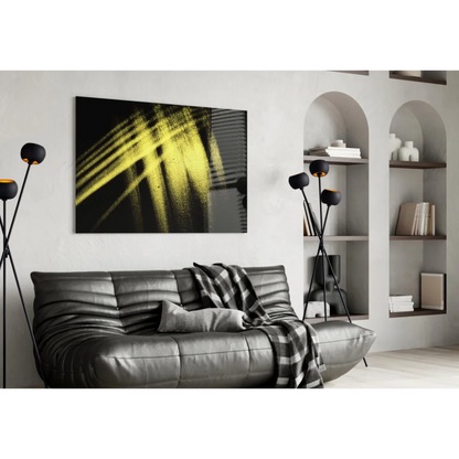 Bold yellow brushstroke glass wall art on black canvas with textured strokes