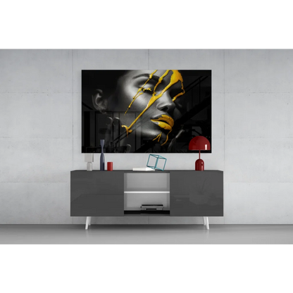 Bold gold drip black-and-yellow abstract portrait wall art canvas above gray console