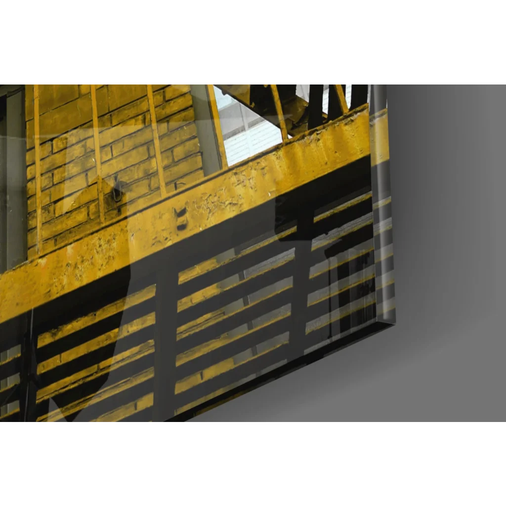 Yellow black striped safety railing on reflective glass wall art