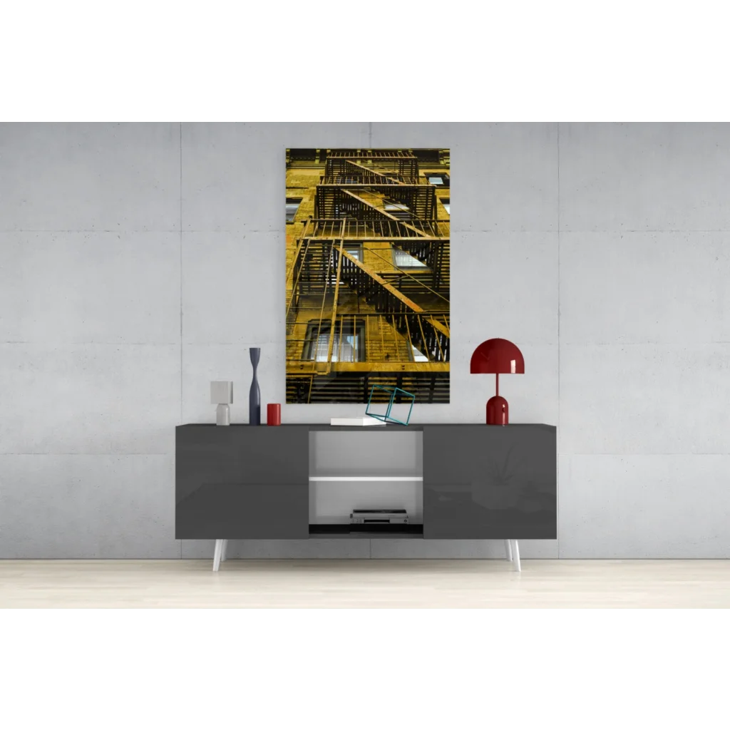Golden fire escape glass wall art print on dark background