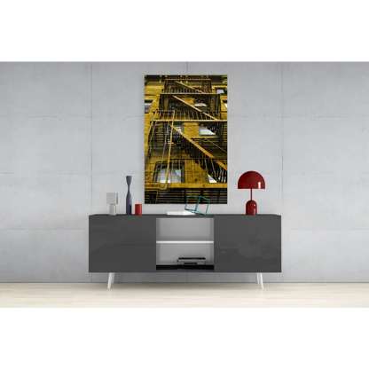 Golden fire escape glass wall art print on dark background
