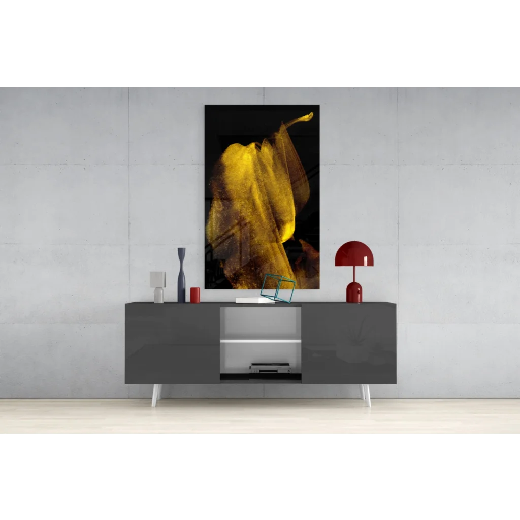 Vibrant yellow banana-shaped glass wall art on black background