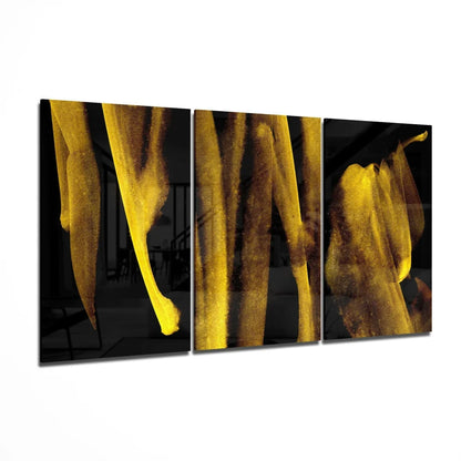 Golden banana leaf glass wall art: glowing yellow leaves on dark canvas panels