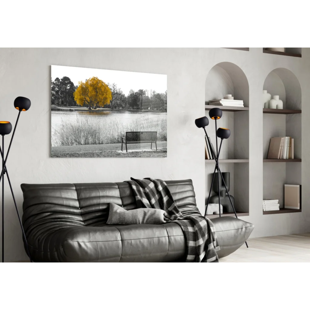 Vibrant yellow tree in black-and-white glass wall art lakeside print