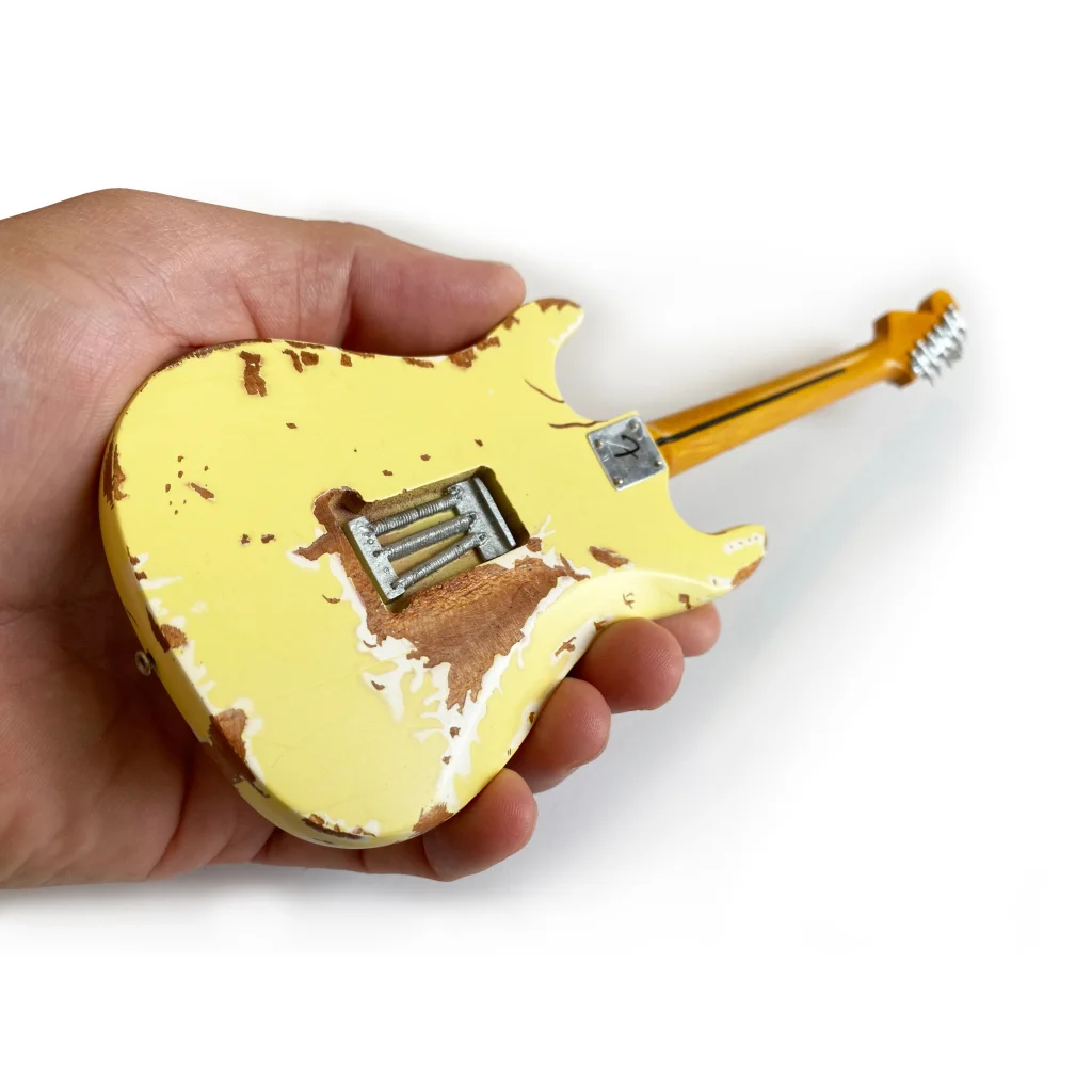 Yngwie Malmsteen mini guitar by Axe Heaven, vintage yellow with distressed finish