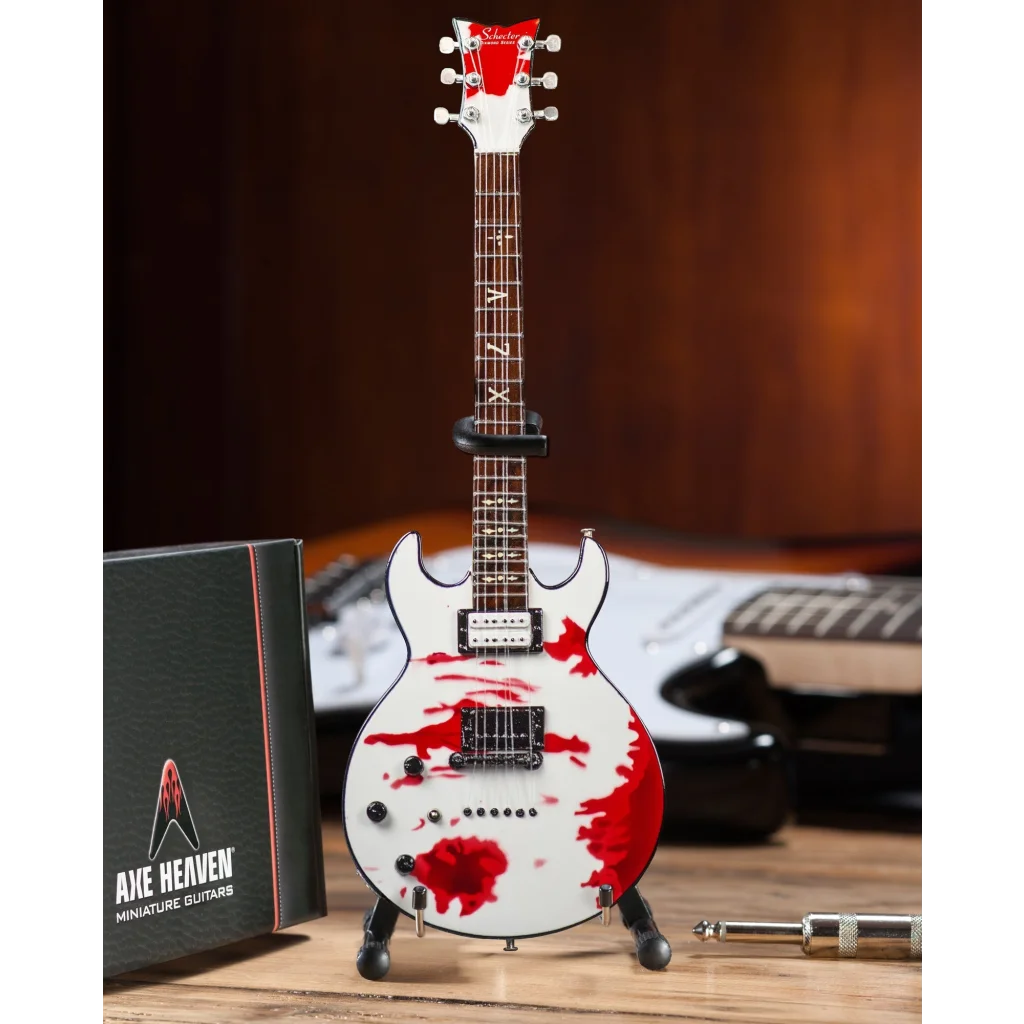 Miniature white Zacky Vengeance Blood Splat Axe Heaven® guitar on adjustable A-frame stand